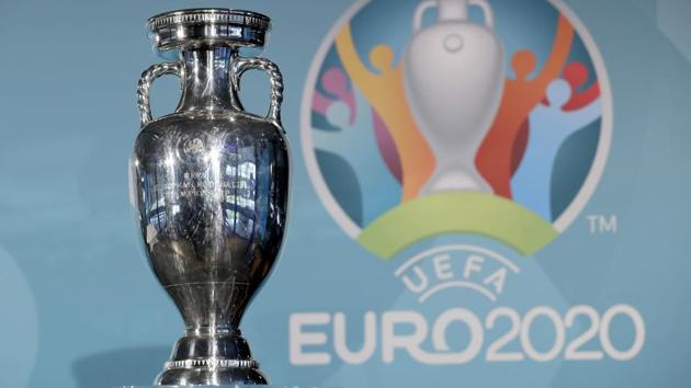 A file photo the Euro soccer championships trophy is seen in front of the logo during the presentation.(AP)