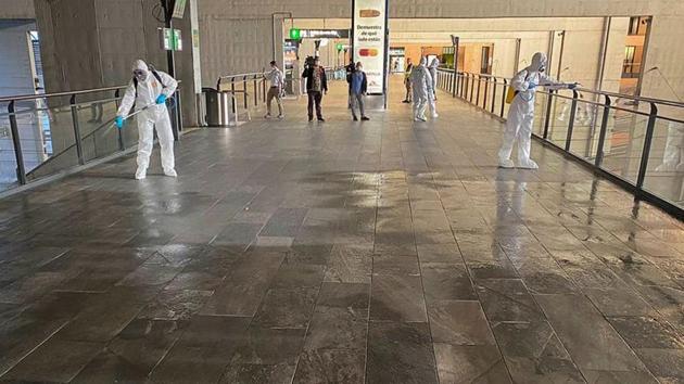 Members of the Military Emergency Unit (UME) disinfecting corridors and hand rails at Santa Justa train station following a partial lockdown as part of a 15-day state of emergency to combat the coronavirus outbreak in Seville, Spain. (Reuters image) Members of the Military Emergency Unit (UME) disinfecting corridors and hand rails at Santa Justa train station following a partial lockdown as part of a 15-day state of emergency to combat the coronavirus outbreak in Seville, Spain. (Reuters image)