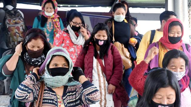 Passenger wearing protective mask in the wake of novel coronavirus, at Guwahati Railway Station last week.(ANI Photo)