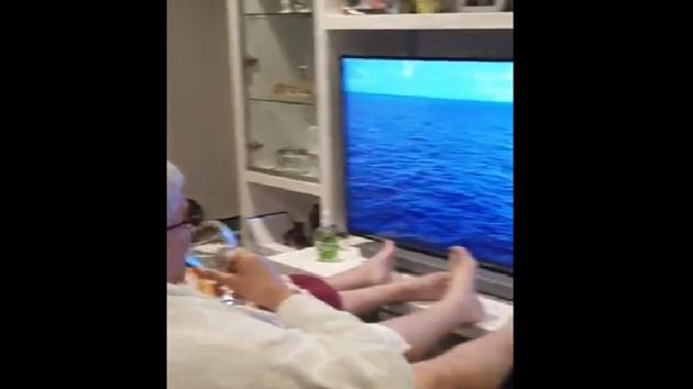 This elderly couple from Australia decided to recreate their cancelled cruise experience by sitting on a couch.(Twitter/@janeyytrill)