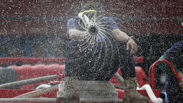 Firemen spray disinfectant outside a market in Manila, Philippines. President Rodrigo Duterte has widened a monthlong quarantine in the Manila region to cover all of the country’s main island, a move that risks stalling one of Asia’s fastest-growing economies. The escalation prompted the suspension of Philippine stock, bond and currency trading from Tuesday with trade resuming Thursday. (Aaron Favila / AP) Firemen spray disinfectant outside a market in Manila, Philippines. President Rodrigo Duterte has widened a monthlong quarantine in the Manila region to cover all of the country’s main island, a move that risks stalling one of Asia’s fastest-growing economies. The escalation prompted the suspension of Philippine stock, bond and currency trading from Tuesday with trade resuming Thursday. (Aaron Favila / AP)