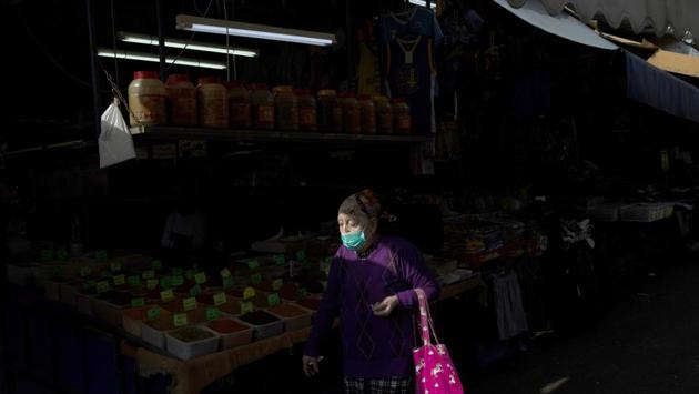 An elderly woman wears a face mask as she shops at a food market in Tel Aviv, Israel. Israel has imposed a number of tough restrictions to slow the spread of the coronavirus. Prime Minister Benjamin Netanyahu announced that schools, universities, restaurants and places of entertainment will be closed to stop the spread of the coronavirus. He also encouraged people not to go to their workplaces unless absolutely necessary. (Oded Balilty / AP) An elderly woman wears a face mask as she shops at a food market in Tel Aviv, Israel. Israel has imposed a number of tough restrictions to slow the spread of the coronavirus. Prime Minister Benjamin Netanyahu announced that schools, universities, restaurants and places of entertainment will be closed to stop the spread of the coronavirus. He also encouraged people not to go to their workplaces unless absolutely necessary. (Oded Balilty / AP)