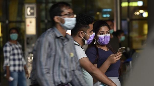 Passengers wearing mask in the sake of coronavirus outbreak arrive at Mumbai’ Chhatrapati Shivaji International Airport on Monday. (Pramod THakur/HT Photo) Passengers wearing mask in the sake of coronavirus outbreak arrive at Mumbai’ Chhatrapati Shivaji International Airport on Monday. (Pramod THakur/HT Photo)