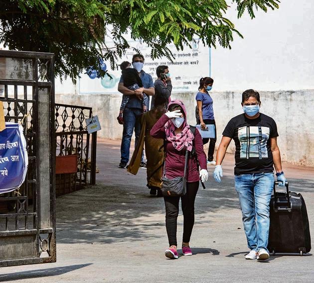 People come out of Naidu hospital wearing masks. (Pratham Gokhale/HT Photo) People come out of Naidu hospital wearing masks. (Pratham Gokhale/HT Photo)