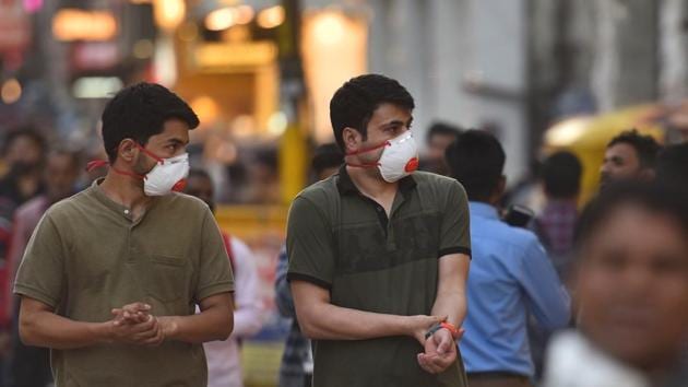 People seen wearing protective masks as precautionary measure following multiple positive cases of coronavirus in the country, at Karol Bagh in New Delhi. (Sanchit Khanna/HT PHOTO) People seen wearing protective masks as precautionary measure following multiple positive cases of coronavirus in the country, at Karol Bagh in New Delhi. (Sanchit Khanna/HT PHOTO)