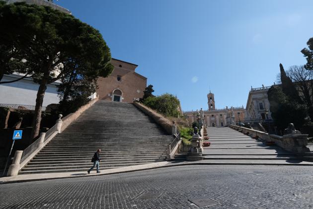 A man walks through a deserted street in Rome. Since last week, Italy has entered complete self-isolation. It has closed schools, offices and services and ordered everyone without a compelling and authorized reason to stay home. The measures are aimed at stopping the spread of the virus. Italy’s authorities are particularly anxious to slow its onset in southern Italy, which has a far less well-funded system than the north. (Crispian Balmer / REUTERS) A man walks through a deserted street in Rome. Since last week, Italy has entered complete self-isolation. It has closed schools, offices and services and ordered everyone without a compelling and authorized reason to stay home. The measures are aimed at stopping the spread of the virus. Italy’s authorities are particularly anxious to slow its onset in southern Italy, which has a far less well-funded system than the north. (Crispian Balmer / REUTERS)
