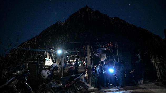 Members of a Naga tribe queue up to be treated at a mobile clinic in Khar Lay village. MAM is conducting research into the conundrum. Zaw Min Lay thinks it could be caused by a combination of a poor diet, genetic predisposition and lack of sunlight in the thick jungle. (Ye Aung Thu / AFP)