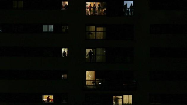 People applaud from their houses in support of the medical staff that are working in COVID-19 outbreak in Rivas Vaciamadrid, Spain. Spanish Prime Minister Pedro Sanchez said his government will declare a two-week state of emergency last Saturday, giving itself extraordinary powers including the mobilization of the armed forces, to confront the COVID-19 outbreak. (Manu Fernandez / AP) People applaud from their houses in support of the medical staff that are working in COVID-19 outbreak in Rivas Vaciamadrid, Spain. Spanish Prime Minister Pedro Sanchez said his government will declare a two-week state of emergency last Saturday, giving itself extraordinary powers including the mobilization of the armed forces, to confront the COVID-19 outbreak. (Manu Fernandez / AP)
