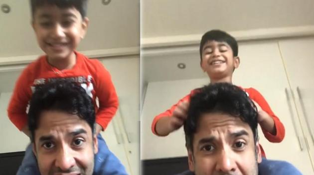 Tusshar Kapoor giving son Laksshya a piggyback ride.