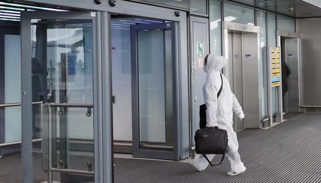 A traveller wearing a protective suit at Heathrow airport in London, Wednesday, March 18, 2020. (AP photo) A traveller wearing a protective suit at Heathrow airport in London, Wednesday, March 18, 2020. (AP photo)