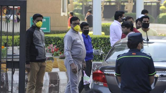 People seen wearing mask as precautionary measure after two coronavirus cases were reported from Noida, at Hyde Park society in Sector 78 on Tuesday.(Sunil Ghosh/HT Photo)