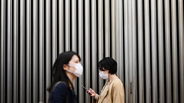 FICTION: You should wear a face mask at all times when outdoors. (Charly Triballeau / AFP) FICTION: You should wear a face mask at all times when outdoors. (Charly Triballeau / AFP)