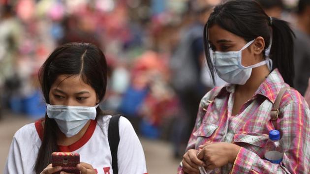 Woman wearing protective face masks as precaution against coronavirus in Kolkata, on Wednesday.(Samir Jana/HT Photo)