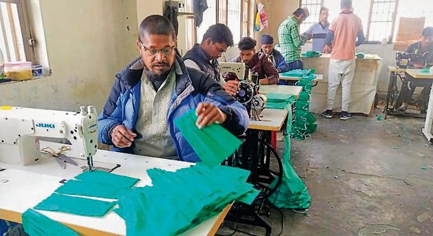 Prisoners preparing masks at Kanda jail in Shimla on Wednesday. (HT PHOTO) Prisoners preparing masks at Kanda jail in Shimla on Wednesday. (HT PHOTO)