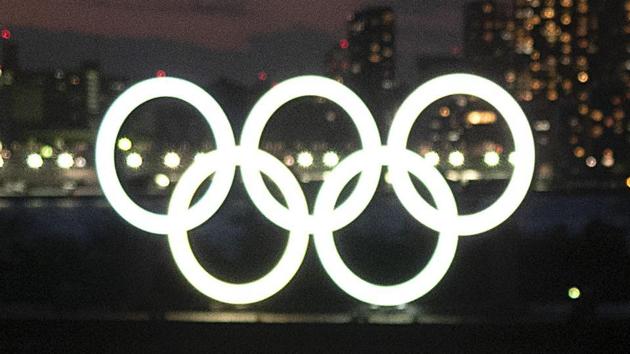 Two women take a selfie with the Olympic rings in the background in the Odaiba section of Tokyo, Thursday, March 12, 2020. (AP) Two women take a selfie with the Olympic rings in the background in the Odaiba section of Tokyo, Thursday, March 12, 2020. (AP)