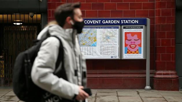 A pedestrian, wearing a face mask as a preventative measure against covid-19, passes Covent Garden Underground Station in London on March 19, 2020 as public transport services in London are reduced in an effort to delay the spread of the novel coronavirus. (AFP) A pedestrian, wearing a face mask as a preventative measure against covid-19, passes Covent Garden Underground Station in London on March 19, 2020 as public transport services in London are reduced in an effort to delay the spread of the novel coronavirus. (AFP)