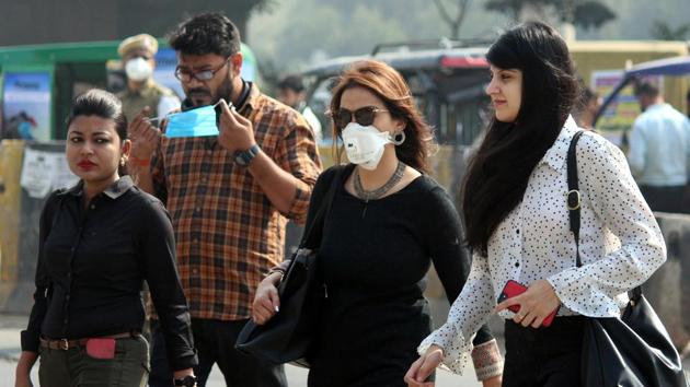 Coronavirus update: People wearing protective face masks as a precaution against coronavirus infections, at Shankar Chowk, near Cyber City, in Gurugram(Yogendra Kumar/HT PHOTO) Coronavirus update: People wearing protective face masks as a precaution against coronavirus infections, at Shankar Chowk, near Cyber City, in Gurugram(Yogendra Kumar/HT PHOTO)