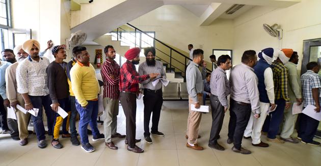 Residents standing in a queue at an auto-driving test centre in Ludhiana.(Gurpreet Singh/HT)