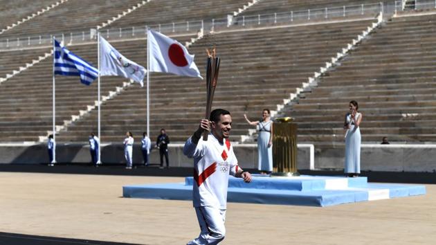 An athlete carries the olympic torch during the olympic flame handover ceremony for the 2020 Tokyo Summer Olympics. (REUTERS) An athlete carries the olympic torch during the olympic flame handover ceremony for the 2020 Tokyo Summer Olympics. (REUTERS)