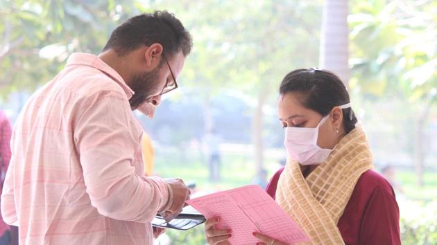 Gurugram, India- March 18, 2020: People seen wearing protective masks as a precautionary measure amid rising coronavirus scare at Civil Hospital, Sector 10, in Gurugram, India, on Wednesday, 18 March 2020. (Photo by Yogendra Kumar/Hindustan Times)(Yogendra Kumar/HT PHOTO) Gurugram, India- March 18, 2020: People seen wearing protective masks as a precautionary measure amid rising coronavirus scare at Civil Hospital, Sector 10, in Gurugram, India, on Wednesday, 18 March 2020. (Photo by Yogendra Kumar/Hindustan Times)(Yogendra Kumar/HT PHOTO)