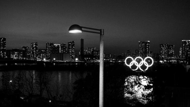 Illuminated Olympic rings float in the water in the Odaiba section of Tokyo(AP)