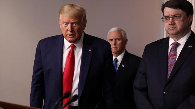 US President Donald Trump is accompanied by Vice President Mike Pence and Veterans Affairs Secretary Robert Wilkie as he arrives for the daily coronavirus response briefing at the White House in Washington, on March 18. (Reuters Photo) US President Donald Trump is accompanied by Vice President Mike Pence and Veterans Affairs Secretary Robert Wilkie as he arrives for the daily coronavirus response briefing at the White House in Washington, on March 18. (Reuters Photo)