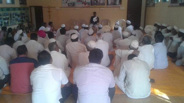 Villagers facing Hiware Bazar’s sarpanch Popatrao Pawar, Padma Shri, while he talks on precautionary measures against Covid-19 (HT PHOTO) Villagers facing Hiware Bazar’s sarpanch Popatrao Pawar, Padma Shri, while he talks on precautionary measures against Covid-19 (HT PHOTO)