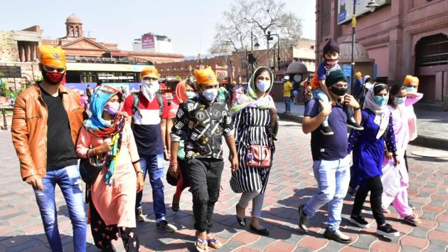 People wearing protective face masks as precaution against coronavirus, in Amritsar, Punjab. (Photo by Sameer Sehgal/Hindustan Times) People wearing protective face masks as precaution against coronavirus, in Amritsar, Punjab. (Photo by Sameer Sehgal/Hindustan Times)