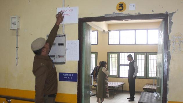 A policeman puts a notice outside a room at a quarantine facility in government post graduate college in Sector 9, in Gurugram, India, on Monday, 16 March 2020. The state government is setting up such facilities to combat coronavirus scare and deal with people who might be affected by this disease. (Yogendra Kumar/HT PHOTO) A policeman puts a notice outside a room at a quarantine facility in government post graduate college in Sector 9, in Gurugram, India, on Monday, 16 March 2020. The state government is setting up such facilities to combat coronavirus scare and deal with people who might be affected by this disease. (Yogendra Kumar/HT PHOTO)