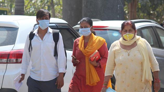 People wearing protective face masks as precautionary measure amid rising coronavirus concerns, at Civil Hospital, in Gurugram, on March 19. (Yogendra Kumar/HT Photo) People wearing protective face masks as precautionary measure amid rising coronavirus concerns, at Civil Hospital, in Gurugram, on March 19. (Yogendra Kumar/HT Photo)