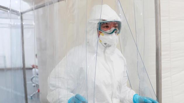 A medical specialist wearing protective gear walks inside the new immediate response mobile hospital with 50 intensive care beds against the outbreak of coronavirus disease (COVID-19). (Reuters photo)