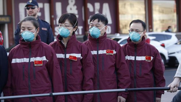 Medics and paramedics from China arrive at the Malpensa airport of Milan. Some 37 between doctors and paramedics were sent along with some 20 tons of equipment, and will be deployed to different hospitals in Italy's most affected area. (AP) Medics and paramedics from China arrive at the Malpensa airport of Milan. Some 37 between doctors and paramedics were sent along with some 20 tons of equipment, and will be deployed to different hospitals in Italy's most affected area. (AP)