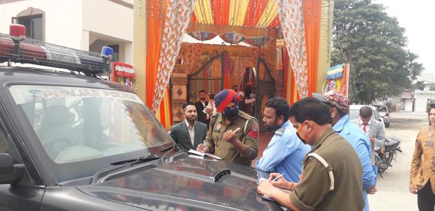 Police officials check a marriage palace in wake of Covid-19 in Jalandhar on Saturday.(Pardeep Pandit/HT Photo)