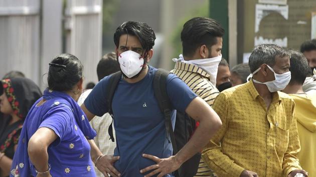People wear protective masks as precaution against coronavirus, outside AIIMS hospital in New Delhi. (PTI) People wear protective masks as precaution against coronavirus, outside AIIMS hospital in New Delhi. (PTI)