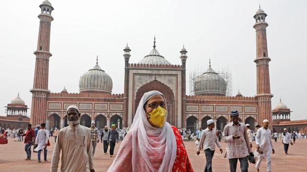 Coronavirus in India: A woman wearing a protective mask following an outbreak of the coronavirus disease (COVID-19) leaves after attending the Friday prayers at the Jama Masjid (Grand Mosque) in the old quarters of Delhi.(REUTERS) Coronavirus in India: A woman wearing a protective mask following an outbreak of the coronavirus disease (COVID-19) leaves after attending the Friday prayers at the Jama Masjid (Grand Mosque) in the old quarters of Delhi.(REUTERS)