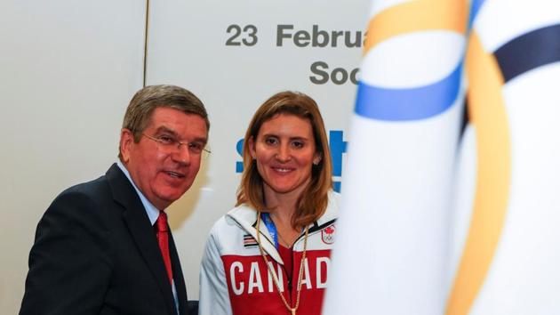FILE PHOTO: International Olympic Committee (IOC) President Thomas Bach (L) welcomes Canada's Hayley Wickenheiser, newly elected member of the IOC, at the IOC session on the final day of the Sochi 2014 Olympic Winter Games in Sochi February 23, 2014. REUTERS/Shamil Zhumatov/File Photo (REUTERS) FILE PHOTO: International Olympic Committee (IOC) President Thomas Bach (L) welcomes Canada's Hayley Wickenheiser, newly elected member of the IOC, at the IOC session on the final day of the Sochi 2014 Olympic Winter Games in Sochi February 23, 2014. REUTERS/Shamil Zhumatov/File Photo (REUTERS)