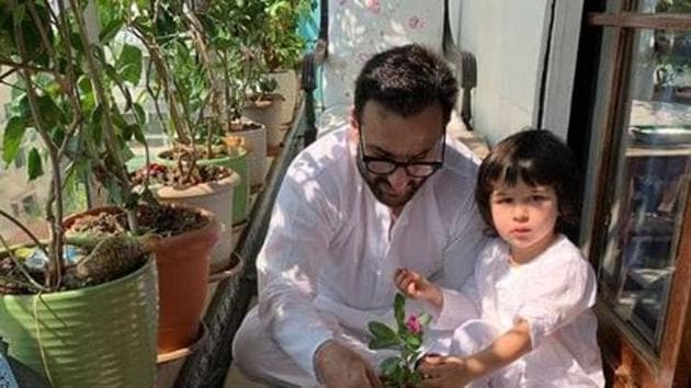 Saif Ali Khan and son Taimur potting plants.