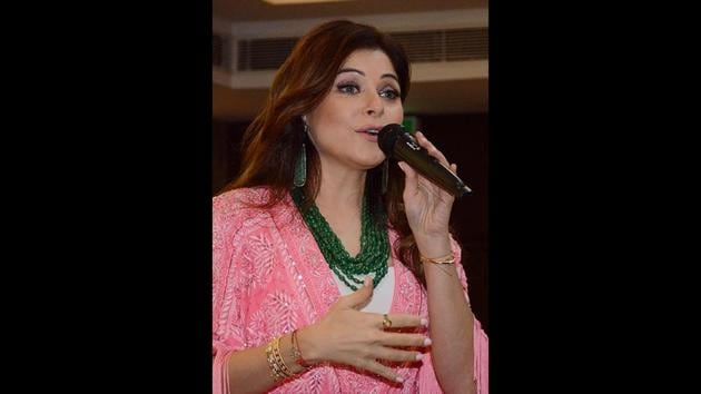 File Photo: Bollywood singer Kanika Kapoor performs during Karva Chauth celebrations in Amritsar. Kapoor became the first Bollywood celebrity to test positive for coronavirus. (Narinder Nanu / AFP)