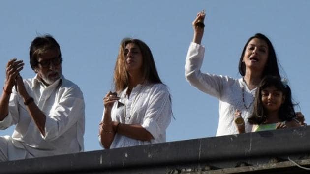 Amitabh Bachchan, Aishwarya Rai Bachchan, Aaradhya and Abhishekh Bachchan clap and ring bells. (Photo by Pramod Thakur/ Hindustan Times)