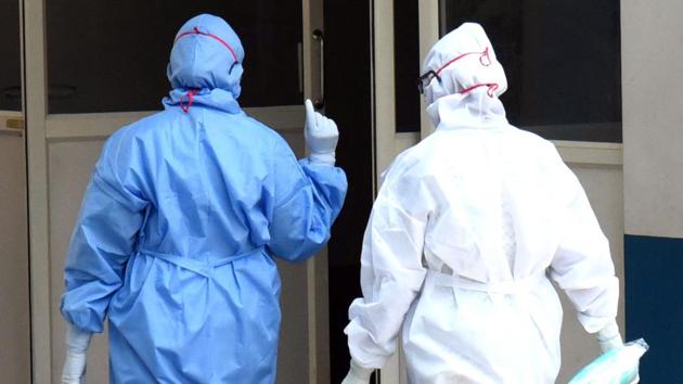 Medical officers wearing protective suits the outside the Special Isolation Ward of Coronavirus patients at Aluva government general hospital in Kochi on Thursday. (ANI photo) Medical officers wearing protective suits the outside the Special Isolation Ward of Coronavirus patients at Aluva government general hospital in Kochi on Thursday. (ANI photo)