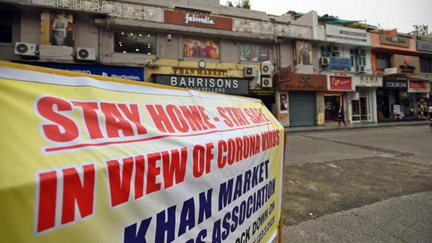 A public safety banner allaying coronavirus concerns is seen at Khan Market in New Delhi. The Confederation of All India Traders (CAIT) on Friday said that markets in Delhi will remain shut from March 21 to 23 as traders try to restrict movement in the city’s busy markets. (Amal KS / HT Photo)