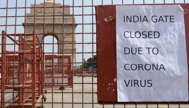 A public notice hangs outside India Gate during Janta Curfew proposed by Prime Minister Narendra Modi -- to prevent the spread of coronavirus, at Humanyun Road, in New Delhi, India, on Sunday, March 22, 2020.(Sushil Kumar/HT PHOTO)