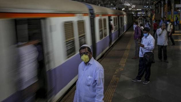 Passengers wearing protective masks wait for a train in Mumbai, India, on Saturday, March 21, 2020. Authorities ordered all non-essential businesses in Mumbai and across the broader state to shut from midnight through the end of March to contain the spread of the novel coronavirus. (Bloomberg) Passengers wearing protective masks wait for a train in Mumbai, India, on Saturday, March 21, 2020. Authorities ordered all non-essential businesses in Mumbai and across the broader state to shut from midnight through the end of March to contain the spread of the novel coronavirus. (Bloomberg)