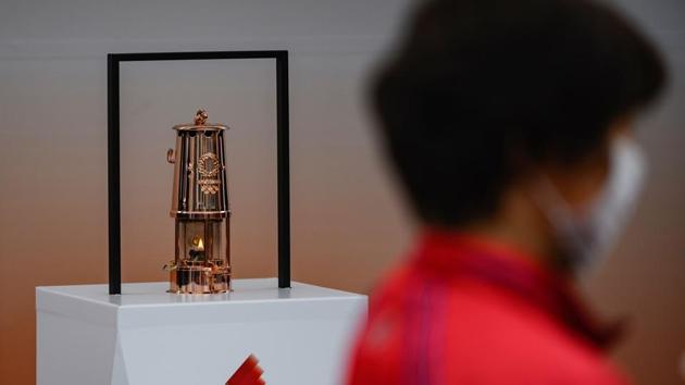 The Tokyo 2020 Olympic flame is displayed outside the railway station in Tono. (AFP) The Tokyo 2020 Olympic flame is displayed outside the railway station in Tono. (AFP)