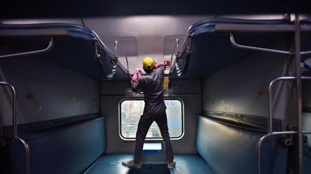 Railway cleaning staff chemically disinfect and sanitize a Rajdhani train as a precautionary measure in view of coronavirus concerns at Railway Yard, Ajmeri Gate in New Delhi. (Raj K Raj / HT Photo)
