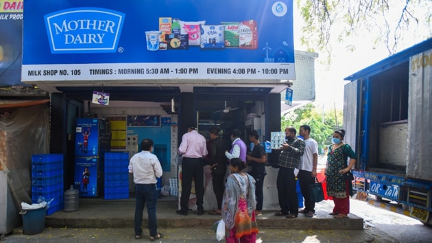 People at a milk booth in Delhi during the lockdown to fight coronavirus. (Amal KS/HT PHOTO) People at a milk booth in Delhi during the lockdown to fight coronavirus. (Amal KS/HT PHOTO)