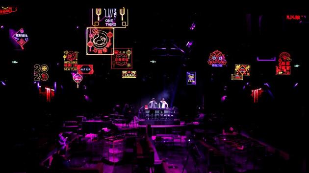 DJs Eddy and Rhythmic perform a set during a live-streamed electronic music event at a closed nightclub, during the novel coronavirus disease (COVID-19) outbreak, in Beijing, China, March 7, 2020. "The advantage is that there will be more people who get to know me through the internet, and to feel the different vibe that music could bring," said Eddy. (REUTERS / Carlos Garcia Rawlins )