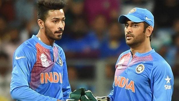 India’s MS Dhoni in conversation with Hardik Pandya.(AFP)