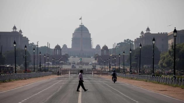 A man crosses a deserted Rajpath in NEw Delhi on Sunday during one-day Janta Curfew imposed as a preventive measure against the Covid-19 outbreak. (AFP Photo) A man crosses a deserted Rajpath in NEw Delhi on Sunday during one-day Janta Curfew imposed as a preventive measure against the Covid-19 outbreak. (AFP Photo)