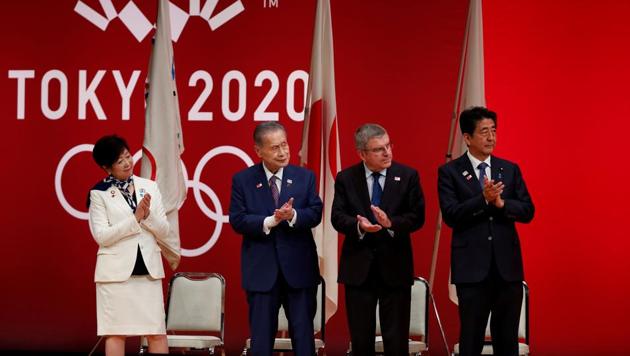 FILE PHOTO : Tokyo Governor Yuriko Koike, Tokyo 2020 President Yoshiro Mori, International Olympic Committee (IOC) President Thomas Bach and Japan's Prime Minister Shinzo Abe attend the 'One Year to Go' ceremony celebrating(REUTERS)